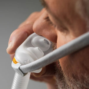 Close-up of the Fisher & Paykel F&P Solo Nasal Pillow CPAP Mask showing the one-touch nasal pillow adjustment system and AutoFit headgear for personalized sleep apnea therapy comfort.
